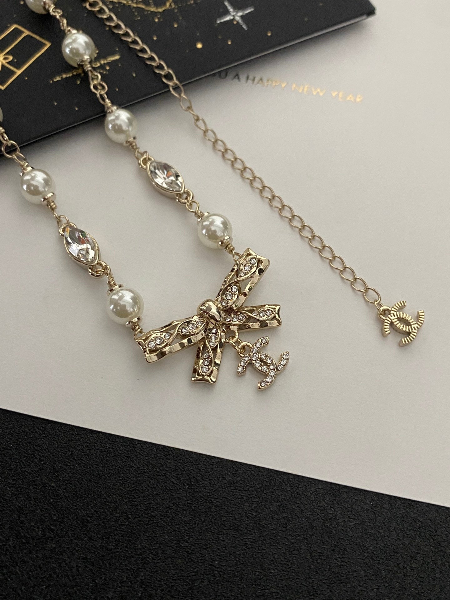 Diamond and pearl bow necklace