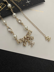 Diamond and pearl bow necklace