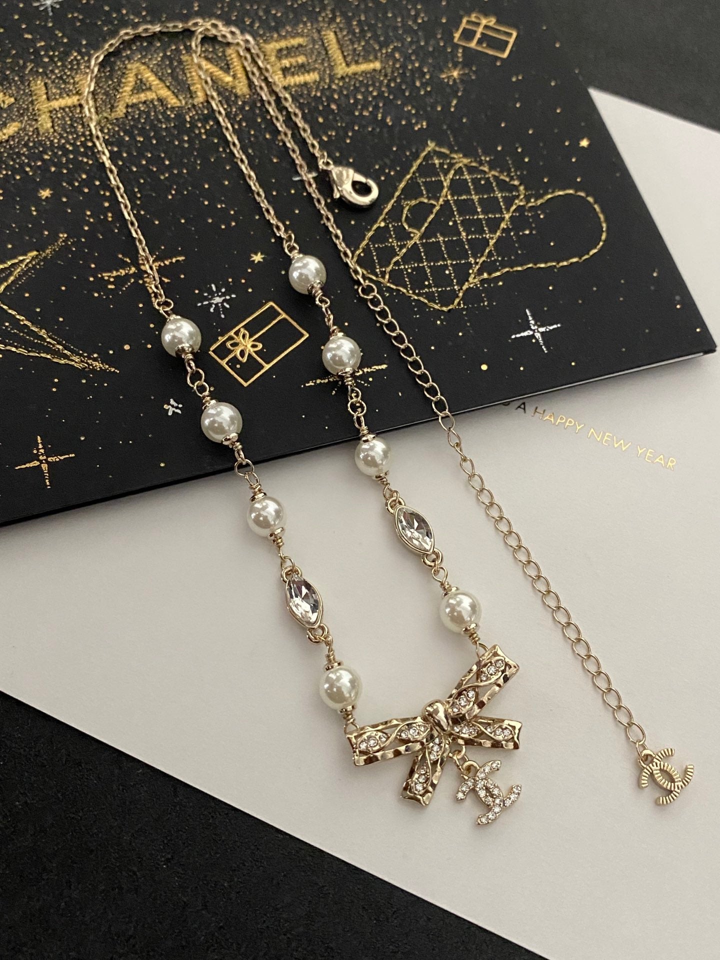 Diamond and pearl bow necklace