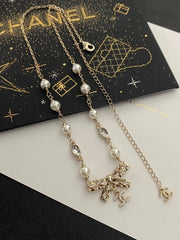 Diamond and pearl bow necklace