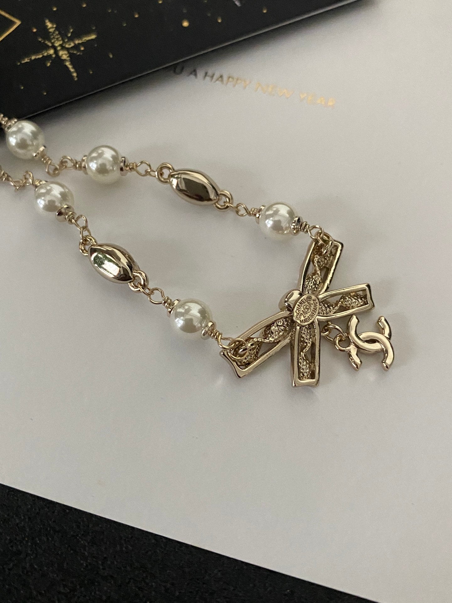 Diamond and pearl bow necklace