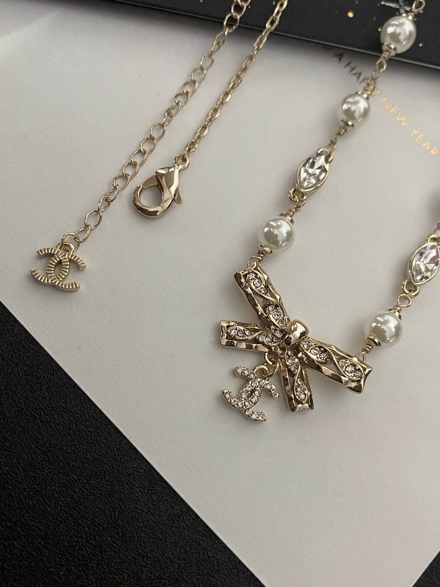 Diamond and pearl bow necklace