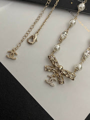 Diamond and pearl bow necklace