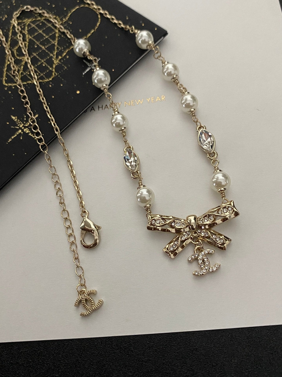 Diamond and pearl bow necklace