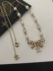 Diamond and pearl bow necklace
