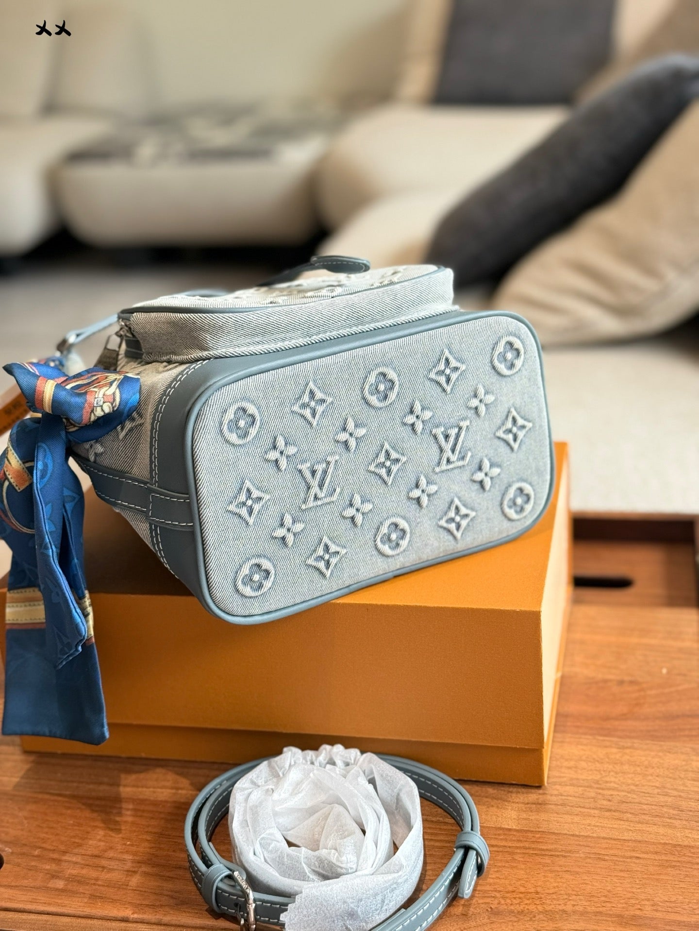 Embossed denim pocket messenger bag