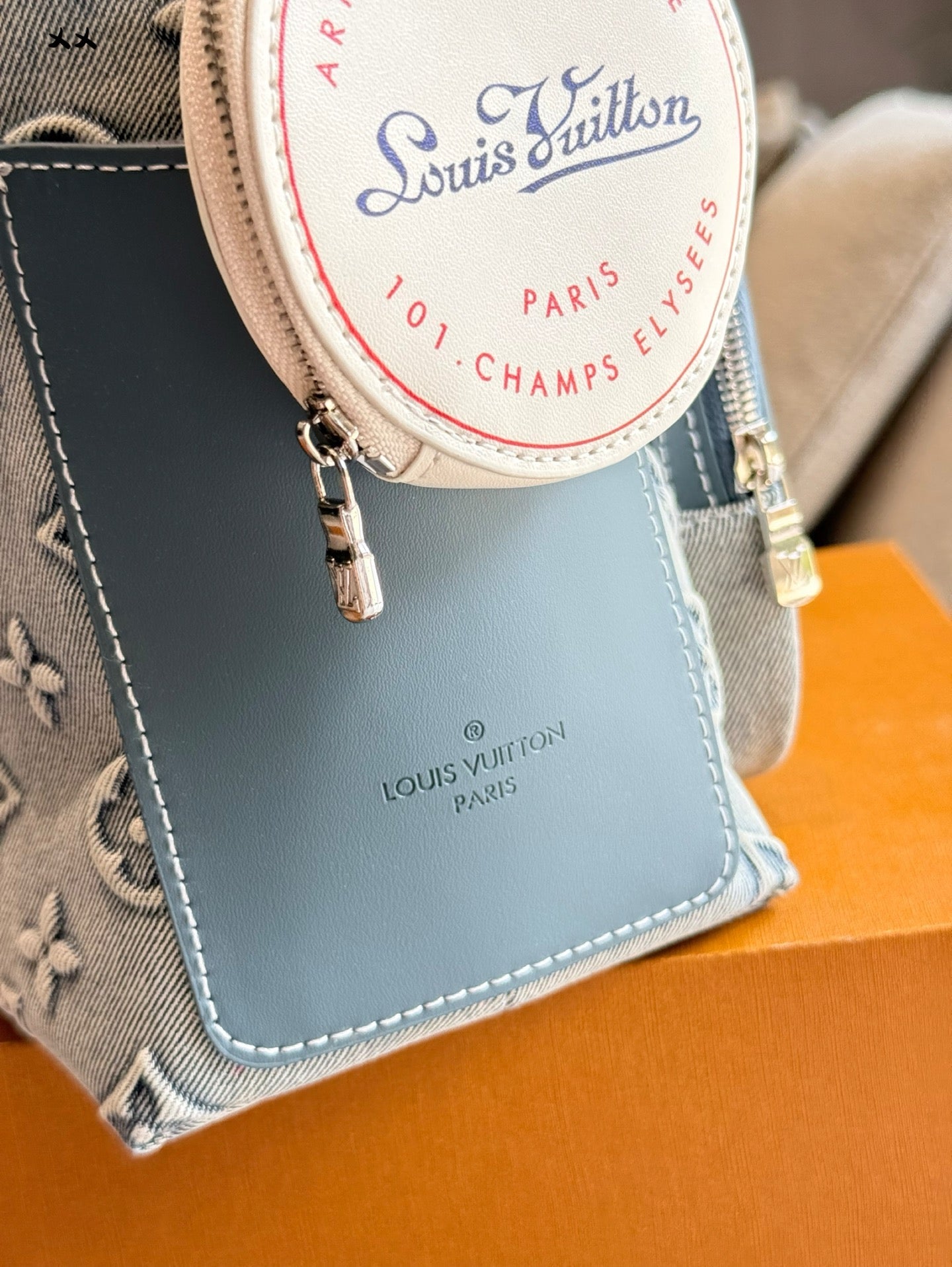 Embossed denim pocket messenger bag