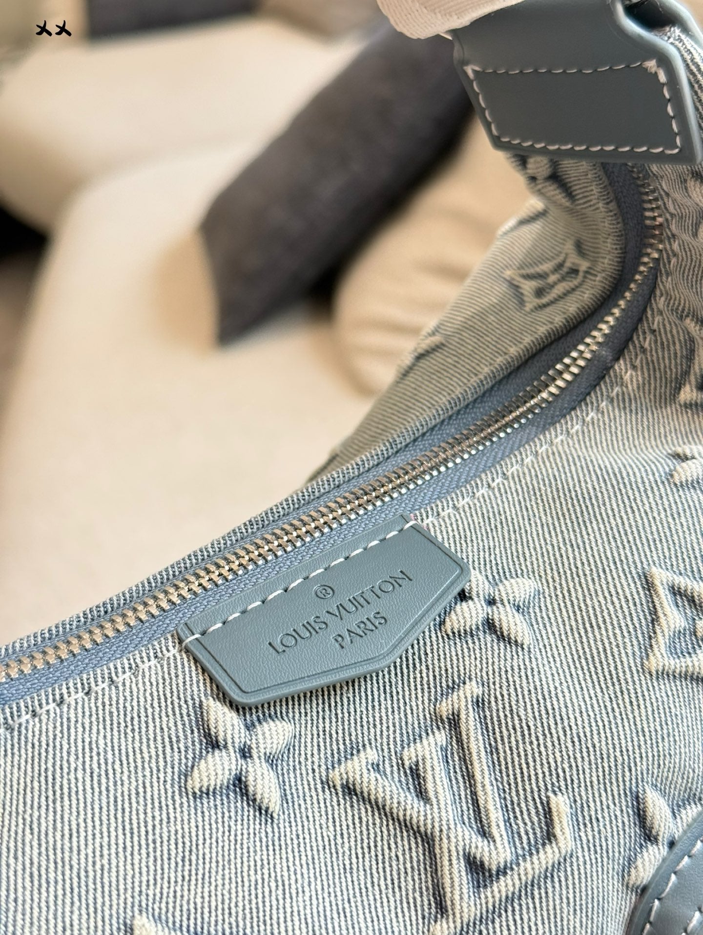 Embossed denim pocket messenger bag