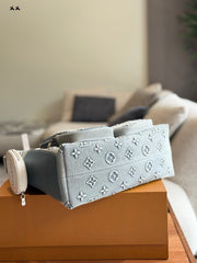 Embossed denim pocket messenger bag