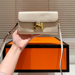 Gold buckle messenger bag