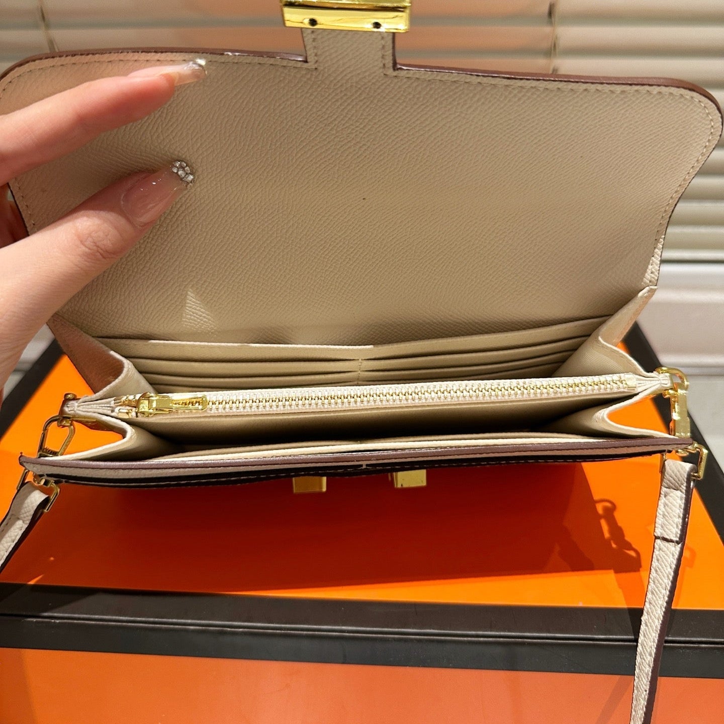 Gold buckle messenger bag