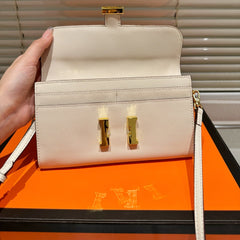 Gold buckle messenger bag
