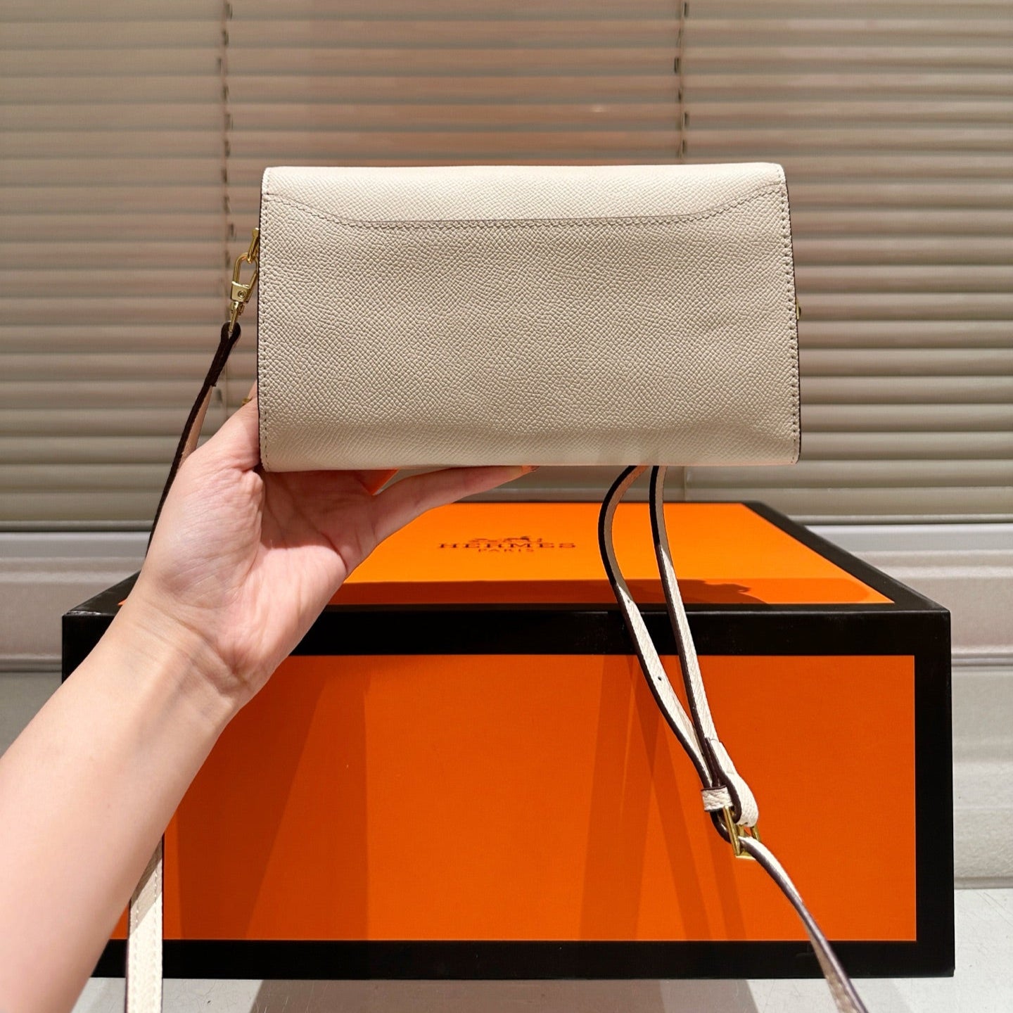 Gold buckle messenger bag