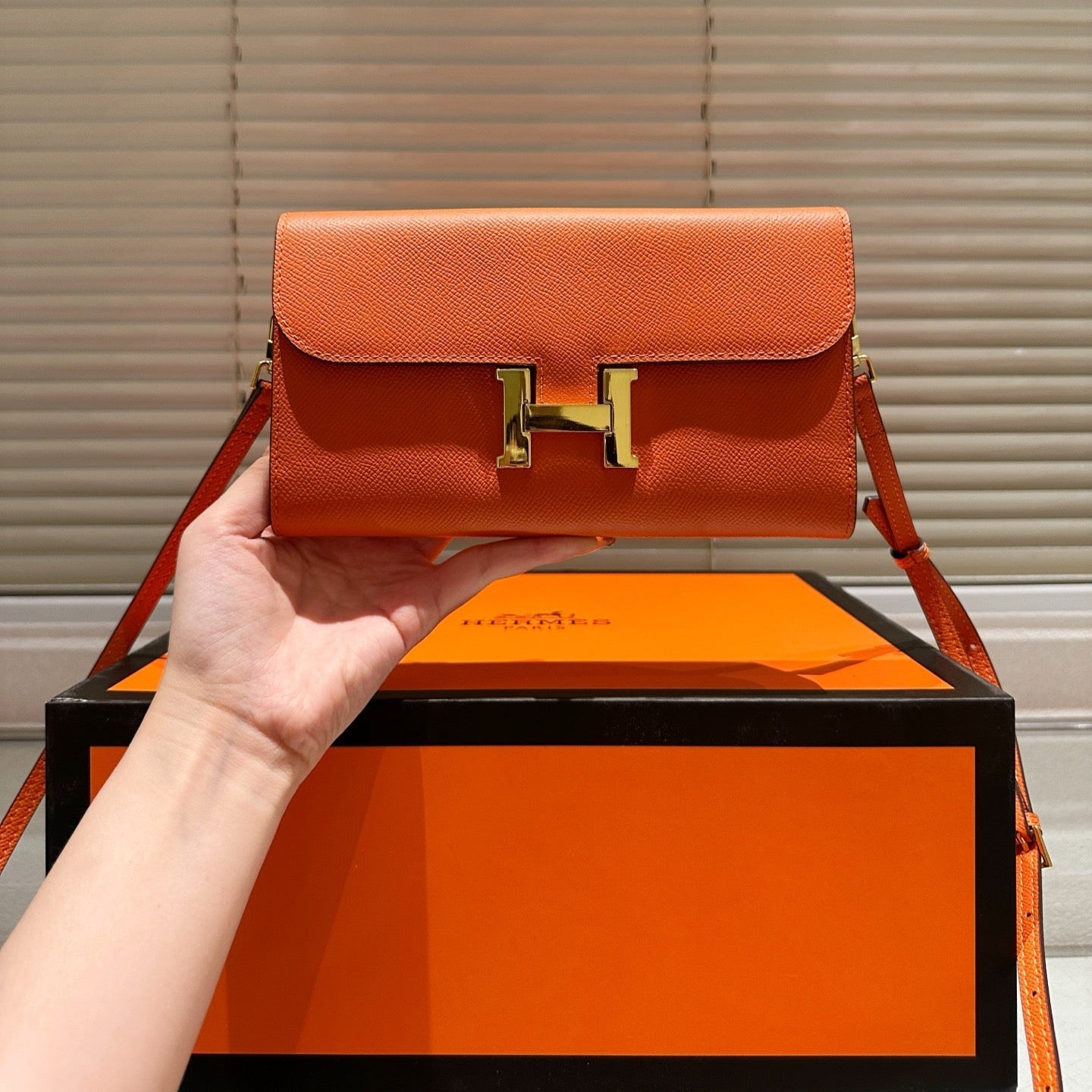 Gold buckle messenger bag