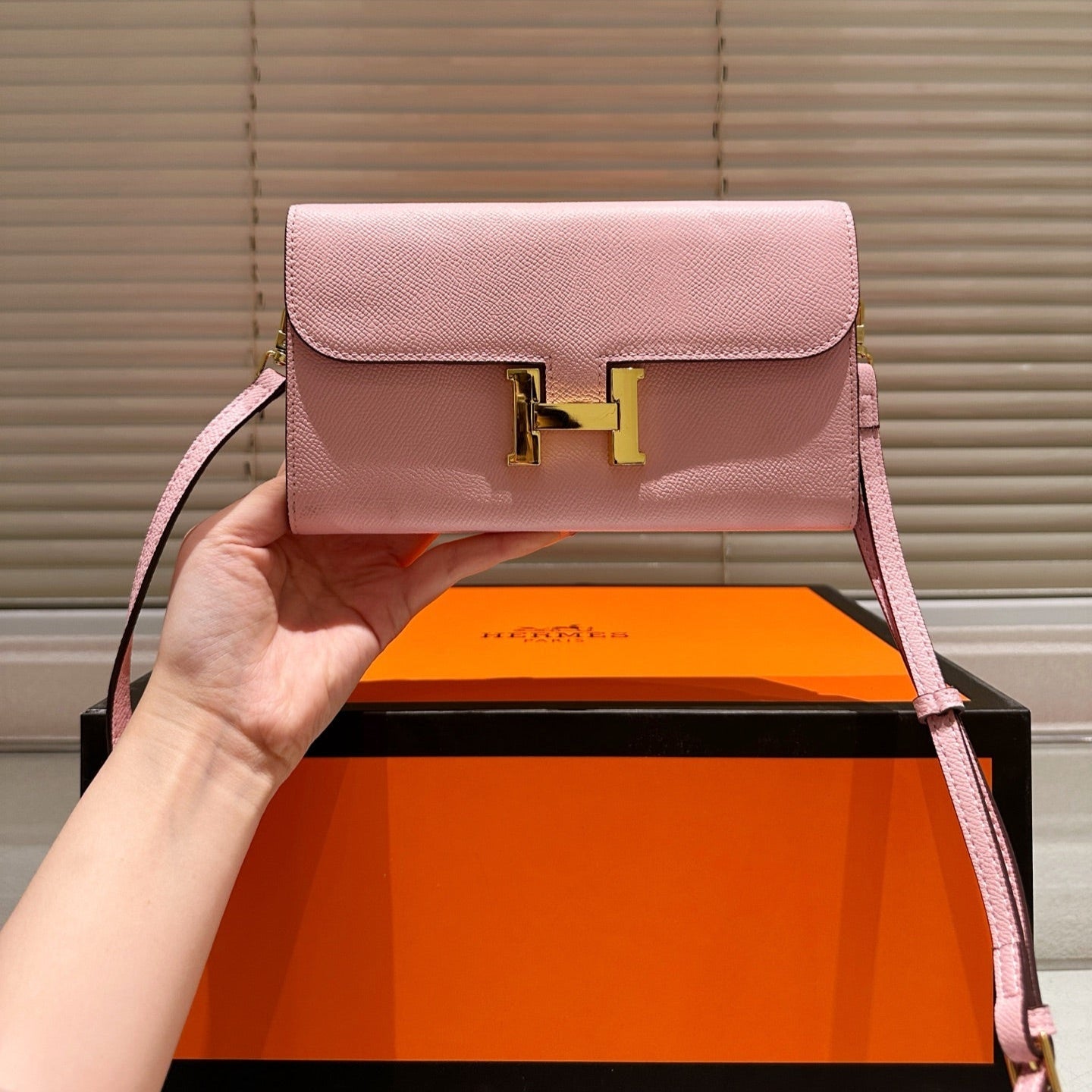 Gold buckle messenger bag