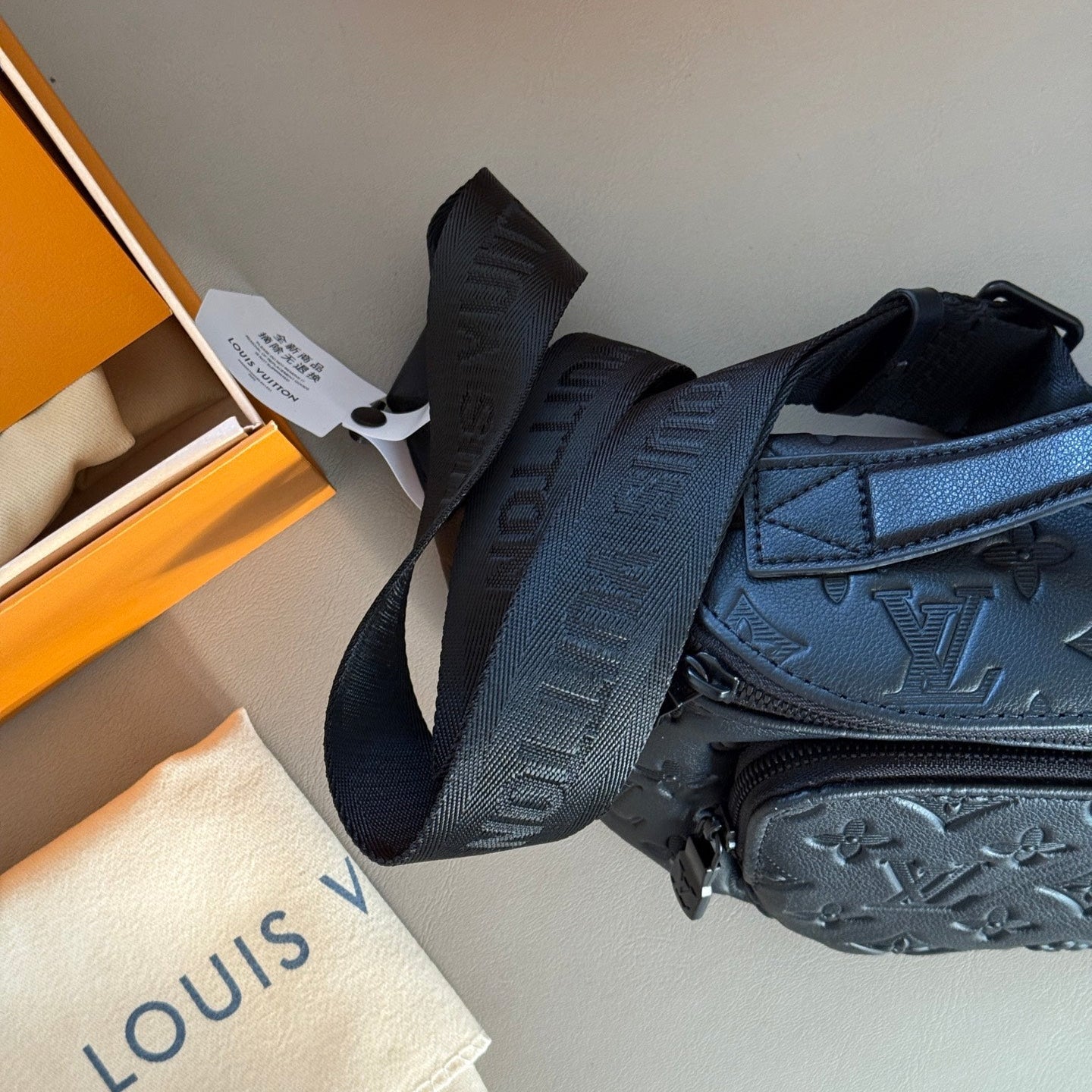 Black embossed leather crossbody waist bag