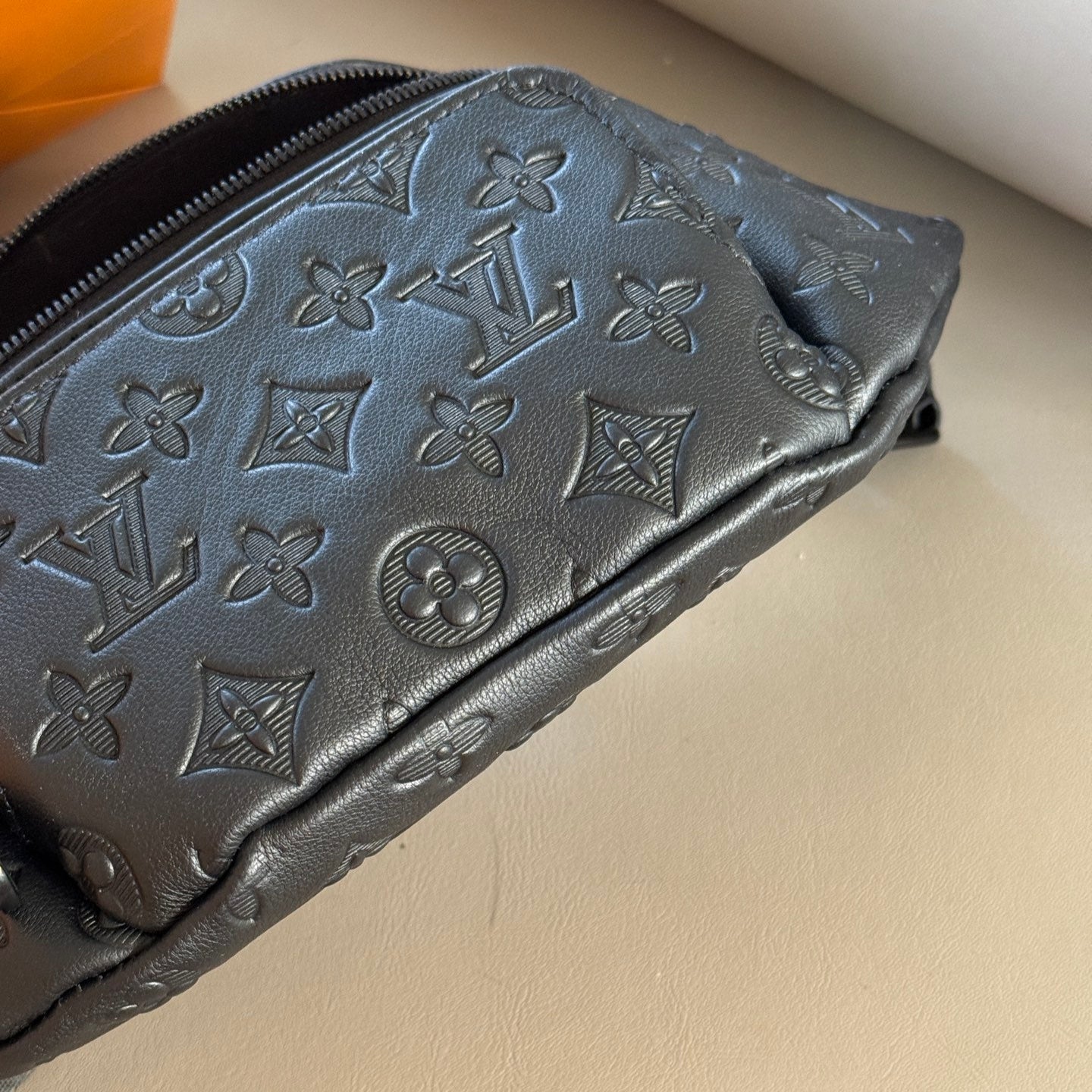 Black embossed leather crossbody waist bag