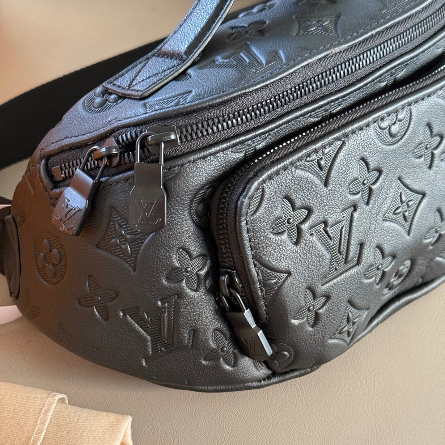 Black embossed leather crossbody waist bag