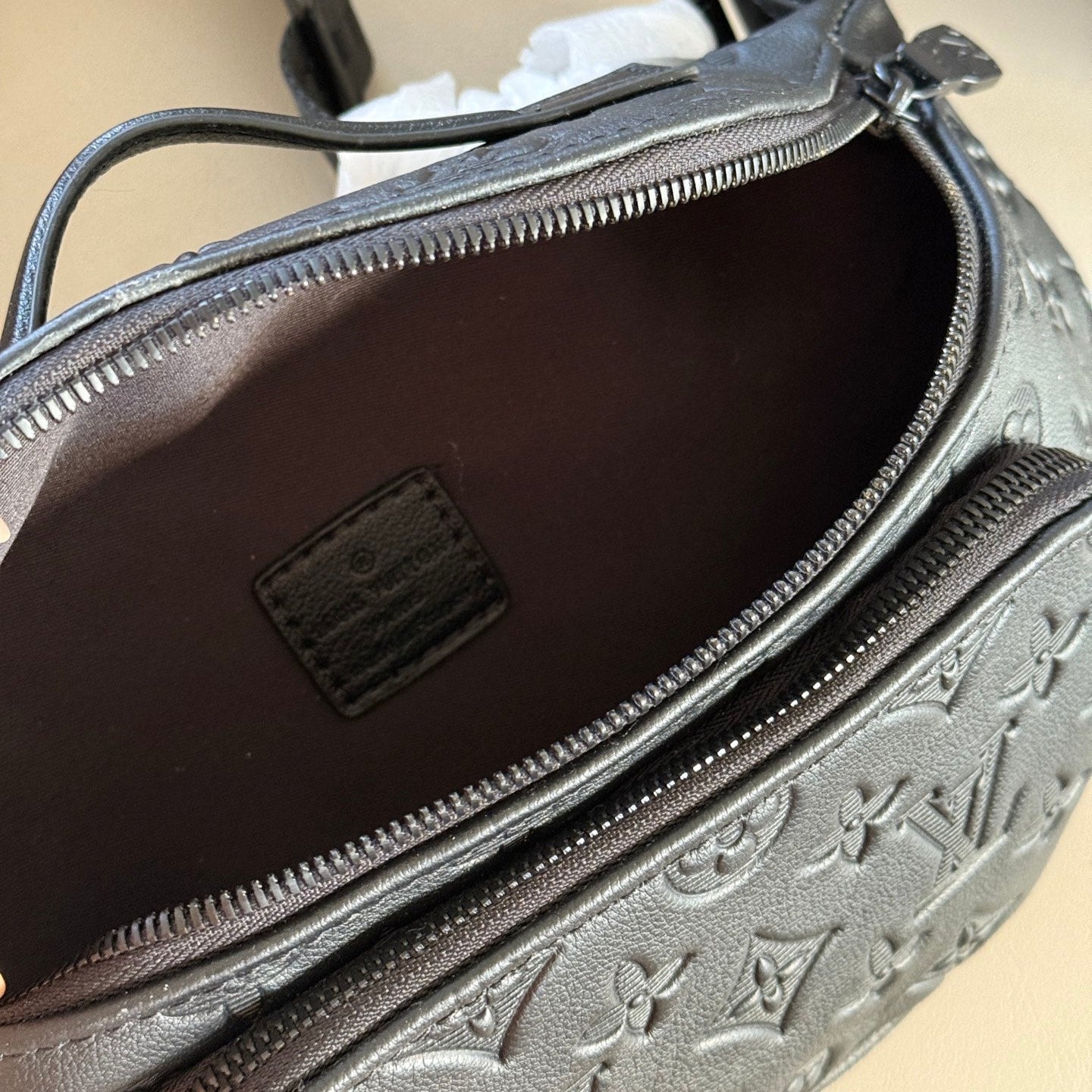 Black embossed leather crossbody waist bag
