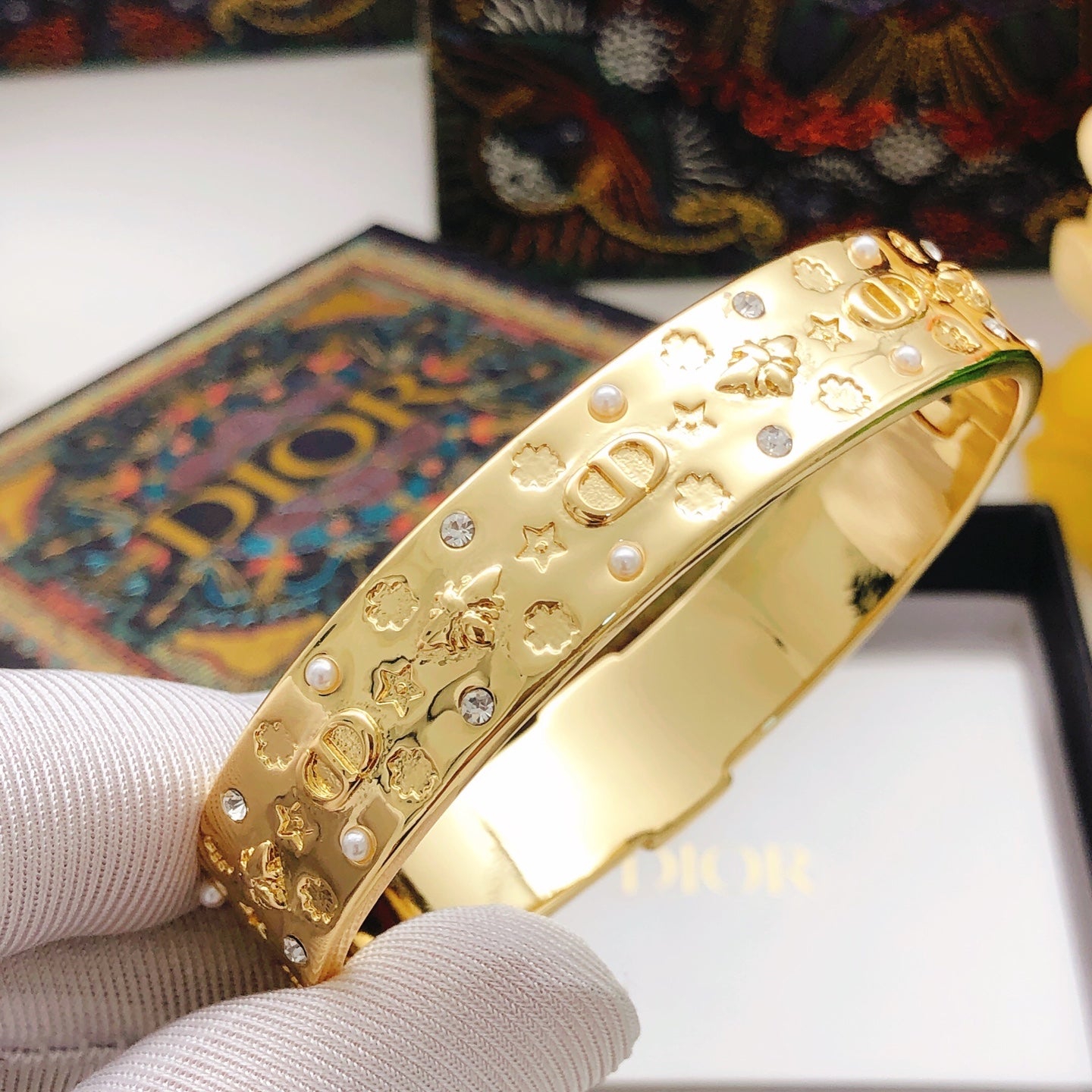 Bee engraved pearl and diamond bracelet