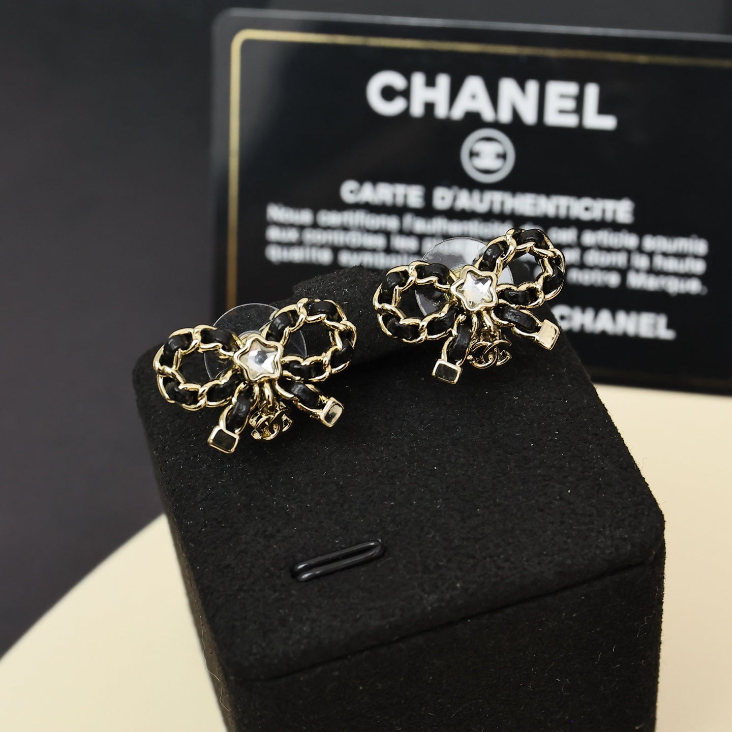 Leather chain bow star earrings