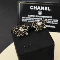 Leather chain bow star earrings