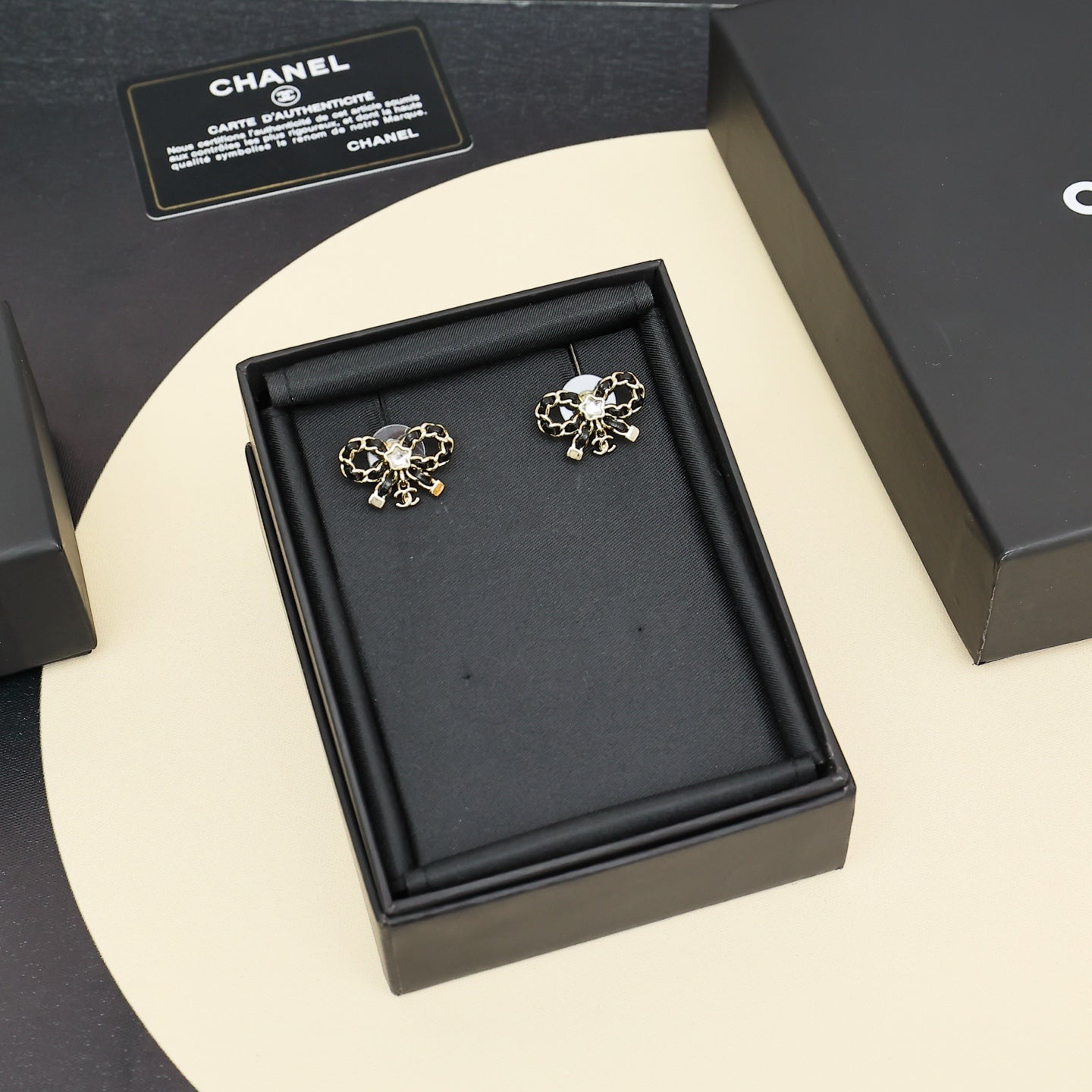 Leather chain bow star earrings