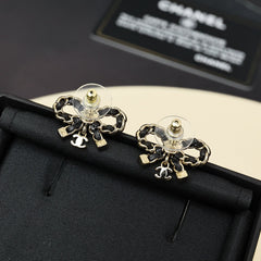 Leather chain bow star earrings