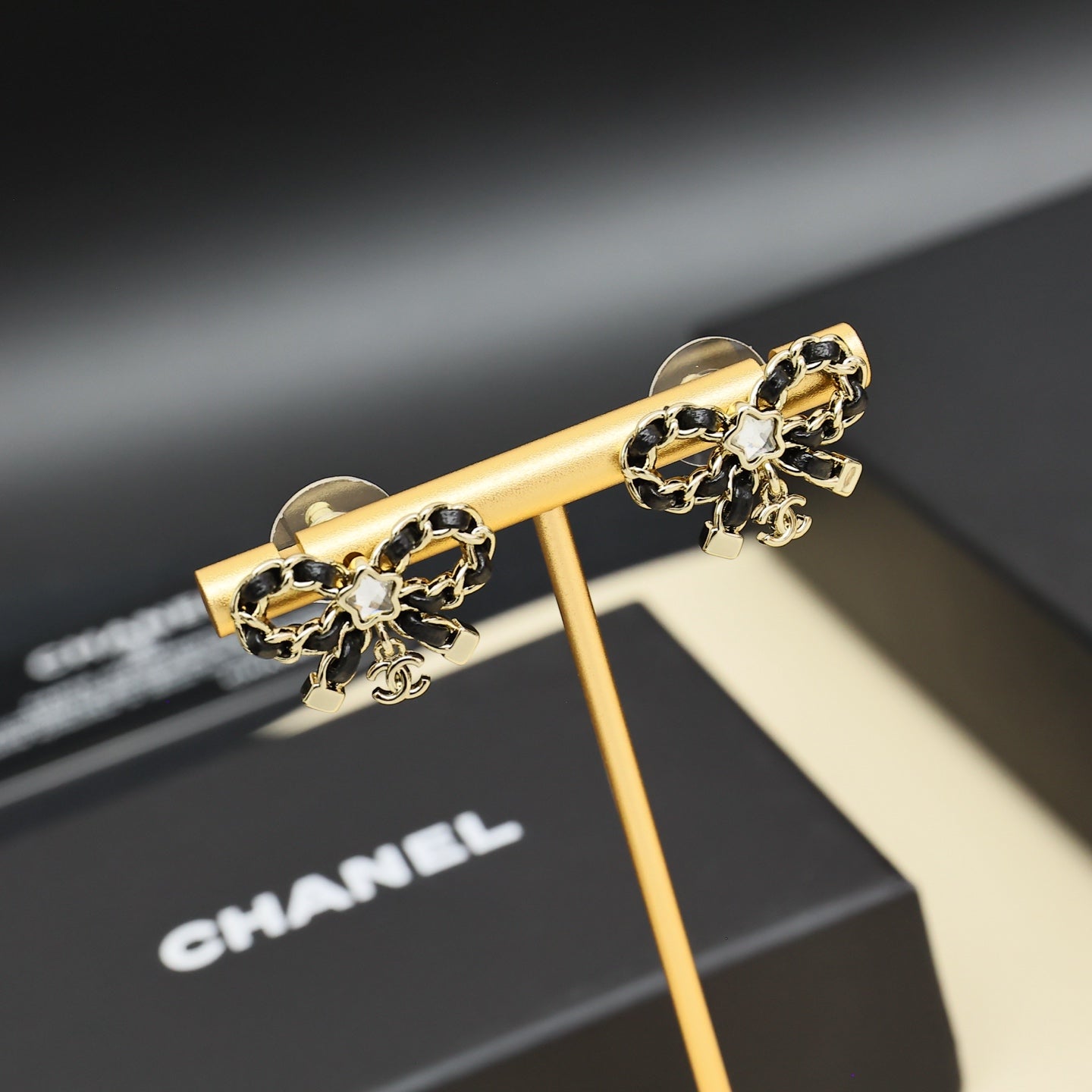 Leather chain bow star earrings