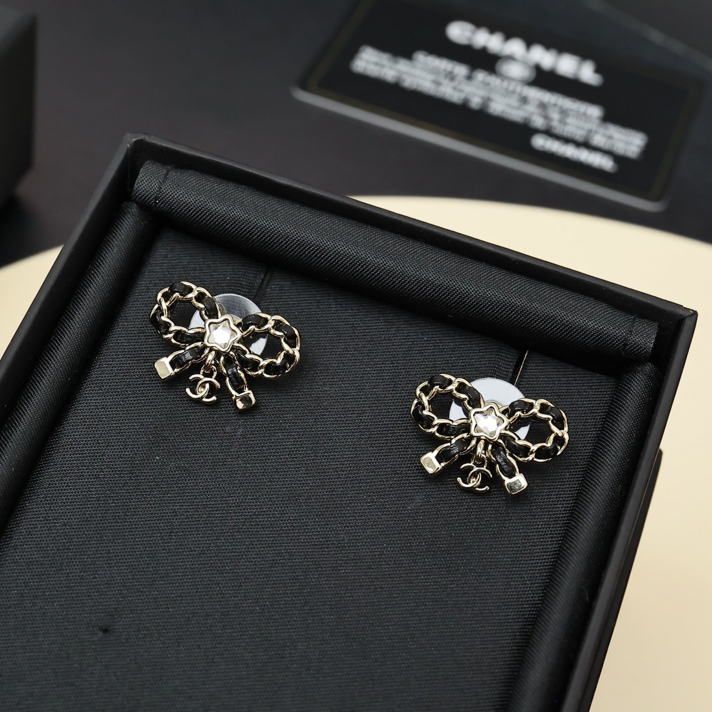 Leather chain bow star earrings